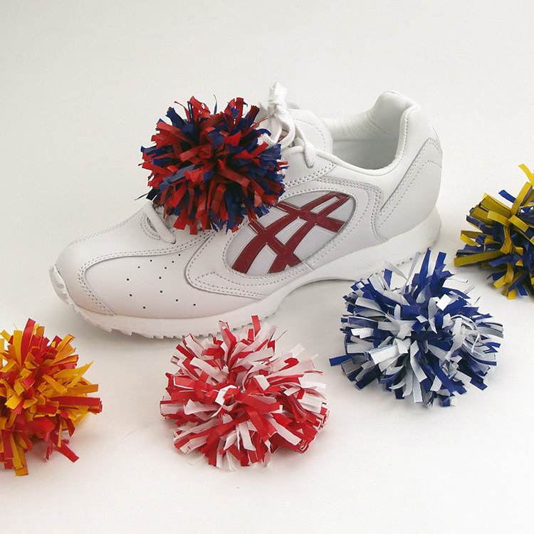 Shoe with red and royal blue shoe pom, bright gold and red shoe pom, red and white shoe pom, royal blue and white shoe pom, and neon yellow and royal blue shoe pom